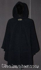 Cloak:3225, Cloak Style:Shaped Shoulder Ruana Cloak<br>with pockets, Cloak Color:Navy Blue, Fiber / Weave:WindPro Fleece, Cloak Clasp:Triple Medallion, Hood Lining:Unlined faux shearling interior<br>double sided fabric, Back Length:39" back<br>29" overarm, Neck Length:21", Seasons:Fall, Spring, Winter, Note:A classic navy blue windpro<br>shape shoulder ruana WITH POCKETS!<br>that will keep you warm and dry on chilly nights.<br>This soft and cuddly cloak has an<br>interior faux shearling texture<br>for extra comfort and a water resistant<br>outer layer to keep you dry during light rain/snow.<br>The pewter triple medallion clasp is the<br>final touch on this functional and elegant cloak.<br>This shape shoulder ruana makes a<br>great driving cloak with shorter sides and<br>less bulk easy arm mobility.<br>Machine washable<br>DO NOT DRY CLEAN..