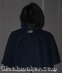 Cloak:3234, Cloak Style:Shaped Shoulder-Short (youth), Cloak Color:Heathered Navy and Sapphire Blue, Fiber / Weave:Fall, Spring, Southern Winter, Cloak Clasp:Vale, Hood Lining:Black Cotton Velveteen, Back Length:21", Neck Length:19", Seasons:Fall, Spring, Southern Winter, Note:This Heathered Navy and Sapphire Blue<br>wool blend youth shape shoulder<br>cloak is a great conversation piece<br>with woven texture throughout<br>resulting in subtle variations in<br>color with different lighting<br> The hood is lined in a durable<br>black velveteen for added warmth and<br>slip prevention from light winds.<br>Spot or dry clean only..