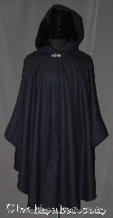 Cloak:3265, Cloak Style:Ruana Shaped Shoulder Cloak, Cloak Color:Navy Blue, Fiber / Weave:100% Wool Twill, Cloak Clasp:Vale, Hood Lining:Navy Polyester Velour, Back Length:44" back<br>29" sides, Neck Length:21", Seasons:Fall, Spring, Note:A classic navy blue full circle cloak<br>with a matching navy thick pile<br>velour lined hood.<br>Perfect for fall outings.<br>A cross between a cape and a cloak,<br>a shape shoulder ruana is a<br>great way to keep warm<br>while frequent, unhindered use of<br>your arms is needed.<br> With fitted shoulders for less bulk.<br>The sides reach with an overarm of 29"<br>Spot or dry-clean only..