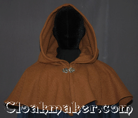 Cloak:3310, Cloak Style:Shaped Shoulder-Short, Cloak Color:Tawny brown, Fiber / Weave:100% Wool, Cloak Clasp:Vale, Hood Lining:Unlined, Back Length:14.5", Neck Length:20.5", Seasons:Southern Winter, Fall, Spring, Note:A perfect short capelet starter cloak<br>or formal evening during<br>cold receptions or child's first cloak.<br>Made of a warm tawny brown<br>100% wool and adorned with an<br>elegant vale pewter clasp.<br>Dry or spot clean only..