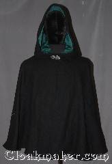 Cloak:3317, Cloak Style:Narrow shoulder multi panel, Cloak Color:Black, Fiber / Weave:100% Wool, Cloak Clasp:Vale, Hood Lining:Sea green cotton velveteen, Back Length:29", Neck Length:20.5", Seasons:Winter, Southern Winter, Fall, Spring, Note:A classic black narrow shouldered<br>multi-panel cloak is eco-conscious made<br>from slightly different black wool fabric<br>remnants wast free.<br>Ideal for cool fall evenings.<br>Made from 100% wool melton.<br>This cloak has a basic vale clasp and<br>sea green cotton velvet hood lining.<br>Designed with bulk than a full circle cloak with<br>fitted shoulders for a fitted look.<br>Spot or dry clean only..