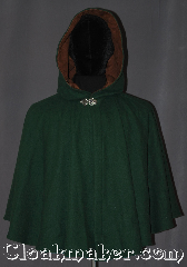 Cloak:3323, Cloak Style:Shaped Shoulder-Short, Cloak Color:Hunter Green, Fiber / Weave:100% wool melton, Cloak Clasp:Vale, Hood Lining:Brown Faux Suede, Back Length:24.5" back<br>23" overarm, Neck Length:19.25", Seasons:Fall, Spring, Southern Winter, Winter, Note:This youth/ Young adult short shape<br>shoulder cloak is a perfect first cloak<br>that will grow with your child<br>for years to come.<br>Short enough for play and made of<br>a rugged, warm green 100% wool<br>with a faux suede hood lining,<br>and adorned with a elegant<br>pewter vale clasp.<br>Handwash cold.