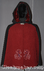 Cloak:3354, Cloak Style:Shaped Shoulder Parti Cloak, Cloak Color:Red black Blue Embroidered, Fiber / Weave:Wool Blend, Cloak Clasp:Vale, Hood Lining:Maroon Velvet, Back Length:33.5", Neck Length:19.5", Seasons:Fall, Spring, Southern Winter, Note:A modern mi-parti or parti-coloured<br>is a cloak made of three contrasting<br>fabrics red in front, black on the sides<br>and hood, and a heathered blue on the back.<br>Especially popular at the English<br>mid-century court.<br>Embroidered with two celtic horse heads<br>on the front this eye-catching cloak<br>is a fun garment for any occasion.<br> Dry or spot clean only..