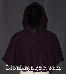 Cloak:3457, Cloak Style:Shaped Shoulder Ruana Cloak, Cloak Color:Plum Purple, Fiber / Weave:Wool Blend, Cloak Clasp:Vale, Hood Lining:Unlined, Back Length:20" back<br>18" side, Neck Length:17", Seasons:Southern Winter, Fall, Spring, Note:The perfect starter cloak for a<br>child / young adult.<br>Bright and colorful plum<br>wool blend melton sized for<br>play and walking.<br>Spot or Dry clean only..