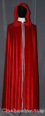 Cloak:3472, Cloak Style:Full Circle Cloak with Collar and Trim, Cloak Color:Red, Fiber / Weave:polyester Stretch Velvet, Cloak Clasp:Hidden Hook & Eye, Hood Lining:Unlined<br>3-Strand Celtic Braid,<br>Narrow Silver/Black trim<br>on hood and down front, Back Length:56.5", Neck Length:22.5", Seasons:Fall, Spring, Summer, Note:A unique piece with a formal flair this<br>full circle cloak has a added interior collar.<br>Made of a stretch velvet with a<br>theatrical drape / bounce<br>ideal for cool fall evenings<br>with a hidden hook and eye clasp<br>and 3-Strand Celtic Braid,<br>Narrow
Silver/Black trim edging.<br>Perfect for when you don't<br>want to wear a scarf.<br>Machine washable..