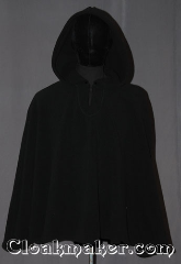 Cloak:3528, Cloak Style:Shape Shoulder<br>Pullover, Cloak Color:Black, Fiber / Weave:Windpro Fleece, Cloak Clasp:TBD Keyhole, Hood Lining:Unlined matching Shearling interior<br>double sided fabric, Back Length:29", Neck Length:21", Seasons:Winter, Southern Winter, Fall, Spring, Note:A classic black windpro shape shoulder<br>pullover cloak that will keep you<br>warm and dry on chilly nights.<br>This soft and cuddly cloak has a interior<br>faux shearling texture for extra comfort.<br>The final touch on this functional and<br>elegant cloak is a water resistant outer<br>layer to keep you dry during light rain/snow.<br>A ideal starter cloak for a child or adult.<br>Machine washable.