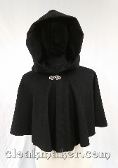 Cloak:3616, Cloak Style:Full Circle Cloak, Cloak Color:Black, Fiber / Weave:100% wool, Cloak Clasp:Vale, Hood Lining:Black Moleskin, Back Length:21", Neck Length:23", Seasons:Spring, Fall, Southern Winter, Note:A short cloak to cover your arms and<br>chest during the chilly days of<br>spring or late fall.<br>The darkest black basket weave fabric<br>is complimented by a black moleskin<br>hood lining, very dramatic.<br>Dry clean only..
