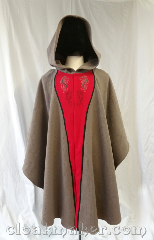 Cloak:3652, Cloak Style:Cape / Ruana, Cloak Color:Taupe, Fiber / Weave:Wool, Cloak Clasp:Snaps, Hood Lining:unlined, Back Length:42", Neck Length:26", Seasons:Southern Winter, Spring, Fall, Note:A taupe colored ruana style cloak,<br>this piece has decorative<br>hippocampus and dragon embroidery<br>and a complimentary applique<br>of red and black edging.<br>Closes with snaps, this cloak<br>is a true neutral taupe color<br>that is grey in some lights and<br>a tad brown in others.<br>Hand wash or machine wash<br>gentle in cold water, line dry, can be<br>machine dried on low temperature..