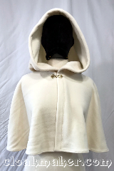 Cloak:3743, Cloak Style:Shaped Shoulder Cloak, Cloak Color:Ivory, Fiber / Weave:200 weight Fleece, Cloak Clasp:Alpine Knot - Goldtone, Hood Lining:Self lined sherpa, Back Length:18", Neck Length:21", Seasons:Spring, Fall, Summer, Note:An ivory shaped shoulder cloak capelet<br>with self lining sherpa texture.<br>Made from 200 weight fleece and<br>has a goldtone apline knot clasp..