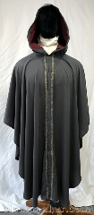Cloak:3744, Cloak Style:Cape / Ruana, Cloak Color:Medium Grey, Fiber / Weave:Polyester, Cloak Clasp:Snap, Hood Lining:Dusty Burgundy moleskin, Back Length:44", Neck Length:22", Seasons:Summer, Note:With its Narrow Florentine trim in<br>gold, blue, and red and it's dusty<br>burgundy moleskin hood lining,<br>this lightweight ruana style cloak<br>is perfect for a sunny day.<br>Made from a medium grey<br>breezy polyester,<br>secures with a snap..