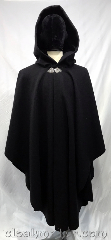 Cloak:3763, Cloak Style:Cape / Ruana, Cloak Color:Black, Fiber / Weave:100% wool, Cloak Clasp:Triple Medallion, Hood Lining:Black Velvet, Back Length:46", Neck Length:22", Seasons:Winter, Southern Winter, Fall, Note:A black shaped shoulder ruana<br>style cloak in heavy felted wool melton<br>with a black velvet hood lining.<br>This cloak is a great winter weight<br>with excellent wind resistance.<br>Made from 100% wool, dry clean only..