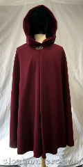 Cloak:3793, Cloak Style:Shaped Shoulder Cloak, Cloak Color:Maroon red, Fiber / Weave:Wool blend suiting, Cloak Clasp:Vale, Hood Lining:Black cherry cordial<br>cotton velveteen, Back Length:41", Neck Length:23", Seasons:Spring, Fall, Southern Winter, Note:Made from a maroon red wool blend<br>suiting with a basket weave<br>patterned fabric, this<br>shaped shoulder cloak has<br>excellent wind resistance<br>and a black cherry cordial<br>cotton velveteen hood lining<br>and a silvertone vale clasp..