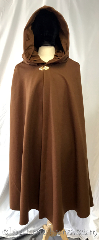 Cloak:3795, Cloak Style:Shaped Shoulder Cloak, Cloak Color:Cinnamon Brown, Fiber / Weave:80% wool, 20% nylon, Cloak Clasp:Vale - Goldtone, Hood Lining:Cinnamon peached polyester<br>water resistant fabric, Back Length:45", Neck Length:23", Seasons:Winter, Southern Winter, Fall, Spring, Note:Spicy cinnamon brown will help<br>warm you up!<br>This shaped shoulder cloak is made<br>from a wool blend and is decorated<br>with a gold tone vale clasp and<br>a matching cinnamon colored,<br>water-resistant fabric that<br>is made from a peached polyester..