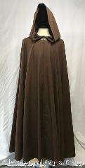 Cloak:3800, Cloak Style:Full Circle Cloak, Cloak Color:Brown Faux Linen, Fiber / Weave:Polyester, Cloak Clasp:Vale, Hood Lining:unlined, Back Length:51.5", Neck Length:21", Seasons:Fall, Spring, Summer, Note:This full circle cloak is made from a<br>brown polyester, made to look like linen.<br>It has a very long pointy liripipe hood<br>and is adorned with a silvertone vale clasp.<br>Machine washable!.