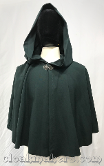 Cloak:3802, Cloak Style:Shaped Shoulder Cloak, Cloak Color:Deep Forest Green, Fiber / Weave:100% wool, Cloak Clasp:Vale, Hood Lining:unlined, Back Length:21", Neck Length:22", Seasons:Fall, Spring, Note:Need something light for shady<br>evenings in the woods?<br>Blend into the trees with this<br>100% wool shaped shoulder cloak<br>in a deep forest green.<br>Accompanied by a silvertone vale clasp.<br>Dry clean only..