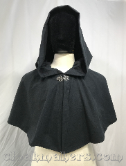 Cloak:3813, Cloak Style:Shaped Shoulder Cloak, Cloak Color:Black, Fiber / Weave:Brushed cotton/polyester flannel, Cloak Clasp:Vale, Hood Lining:unlined, Back Length:17", Neck Length:20", Seasons:Southern Winter, Spring, Fall, Note:A short black full circle cloak made<br>from a brushed cotton/polyester<br>flannel material.<br>Perfect for warmer months when<br>it gets chilly in the evenings.<br>Stays closed with a silvertone vale clasp.<br>Machine washable!.