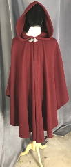 Cloak:3852, Cloak Style:Ruana Cape, Cloak Color:Maroon Red, Fiber / Weave:Plush 100% Wool Coating, Cloak Clasp:Triple Medallion, Hood Lining:unlined, Back Length:43", Neck Length:20", Seasons:Fall, Spring, Southern Winter, Note:This snuggly ruana cloak is made<br>from a plush maroon red wool coating<br>with a silver triple medallion clasp. .