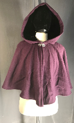 Cloak:3884, Cloak Style:Short Shaped Shoulder, Cloak Color:Plum, Fiber / Weave:Wool Blend, Cloak Clasp:Vale, Hood Lining:Black Silk Velvet, Back Length:23", Neck Length:20", Seasons:Fall, Spring, Southern Winter, Note:Plum purple wool blend short cloak<br>is a dramatic and flirty way to warm<br>
your shoulders and top an outfit,<br>or a classy cloak for a child.<br>Black 
stretch velvet hood lining<br>and pewter vale clasp complete the cloak..