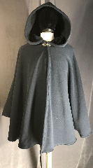 Cloak:3897, Cloak Style:Shaped Shoulder Ruana, Cloak Color:Dark Blue, Fiber / Weave:Windpro Fleece, Cloak Clasp:Vale, Hood Lining:self-lined fleece, Back Length:35", Neck Length:20", Seasons:Winter, Fall, Spring, Note:Deep blue Windpro fleece is<br>amazingly soft, and the plush<br>self-lined 
hood will make you want to<br>burrow into this delightful<br>ruana-style 
cloak.<br>A cross between a cape and a cloak,<br>a ruana is a great way 
to<br>keep warm while frequent, unhindered<br>use of your arms is needed..