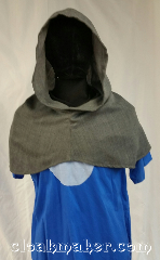 Cloak:H117, Cloak Style:Regular Hood, Cloak Color:Grey, Fiber / Weave:Wool blend suiting, Hood Lining:Unlined, Back Length:10", Neck Length:XL - neck 28", Seasons:Spring, Fall, Winter, Note:This hood is a grey color with a slight<br>tweed of dark and light grey<br>going through it.<br>Wool blend suiting, has been treated<br>so that it's a little shinier and<br>softer than regular wool.<br>Dry clean or hand wash<br>carefully and drip dry.<br>28" neck hole.<br>Pictured on tunic J501<br>Tunic not included..