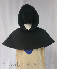 Cloak:H130, Cloak Style:Regular Hood, Cloak Color:Black, Fiber / Weave:WindPro Fleece<br>from Malden Mills, Hood Lining:self lined black sherpa texture, Back Length:10.5", Neck Length:XL - neck 28", Seasons:Southern Winter, Spring, Fall, Note:This hood is made from black<br>WindPro Fleece with a<br>sherpa texture lining.<br>Machine wash cold on gentle,<br>don't dry clean or use fabric softener.<br>28" neck hole.<br>Pictured on tunic J559,<br>tunic not included..