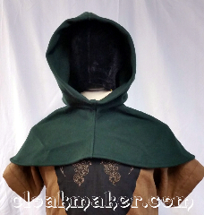 Cloak:H131, Cloak Style:Regular Hood, Cloak Color:Green, Fiber / Weave:Felted Wool Melton, Hood Lining:Unlined, Back Length:6.5", Neck Length:M - neck 24", Seasons:Winter, Southern Winter, Fall, Spring, Note:This hood is made from forest green<br>felted wool melton.<br>Dry clean only.<br>24" neck hole.<br>Pictured on tunic J567,<br>tunic not included.