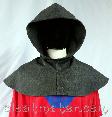Cloak:H140, Cloak Style:regular, Cloak Color:Grey and black twill, Fiber / Weave:Brushed wool, Hood Lining:unlined, Back Length:10", Neck Length:XS - neck 21", Seasons:Fall, Spring, Note:This hood is made from brushed wool in<br>a twill pattern of varying greys.<br>Dry clean only. 21" neck hole.<br>Pictured on tunic J549,<br> tunic not included..