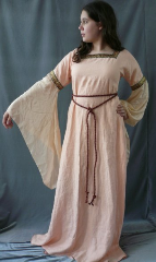 Gown ID:G533, Gown Color:Peach, Style:12th Century, Sleeve:Long Drop sleeve in peach silk Habutai, Trim:Paisley Dancing on the Mountain at bicep, Neckline Type:Square, Fabric:Linen, Sleeve Length:31, Back Length:58.5".