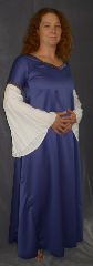 Gown ID:G626, Gown Color:Blue, Style:12th Century, Sleeve:Long drop sleeve of white rayon challis with Medallion trim at bicep, Trim:Medallion trim at bicep and neck, Neckline Type:Square sweetheart, Fabric:Linen / Cotton, Sleeve Length:35", Back Length:58".