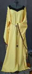 Gown ID:G695, Gown Color:Yellow, Style:12th Century, Sleeve:Long drop sleeve with Sunflower trim on edge, Trim:Sunflower trim on sleeve edge, Neckline Type:Squared sweetheart with black contrasting border, Fabric:Corded Polyester, Sleeve Length:32", Back Length:61".