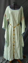 Gown ID:G734, Gown Color:Pale Foam Green, Style:12th Century, Sleeve:Long Drop Sleeve with Stained Glass Pink and White trim on the bicep. Blue piping on sleeve edge., Trim:Stained Glass Pink and White trim on the bicep. Blue piping on sleeve edge., Neckline Type:Ballet, Fabric:Linen, Sleeve Length:27", Back Length:57".
