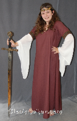 Gown ID:G763, Gown Color:Maroon, Style:12th Century<br>(shown with<br>Diamond Shield Plaque<br>Belt BT0014BZand circlets<br>CT380542UQ and CD080307BR<br>sold separately), Sleeve:Long Drop White Polyester<br> georgette Sleeve<br>with Leaf Helix - rust<br>trim at bicep, Trim:Leaf Helix - rust trim at bicep, Neckline Type:Scoop, Fabric:100% wool<br> Polyester Georgette sleeves, Sleeve Length:30", Back Length:51".