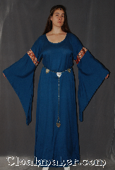 Gown ID:G915, Gown Color:Blue, Style:12th Century<br>(circlet and Silvertone Plated<br>Shell Shield Accolade Belt<br>#BT0020BZ-ST not included), Sleeve:Long Drop Sleeve with<br>Red, Gold, Blue Unique<br>Floral trim on bicep, Trim:Red, Gold, Blue Unique<br>Floral trim on bicep, Neckline Type:Scoop, Fabric:Cotton Blend<br>Machine Washable, Sleeve Length:31", Back Length:60".