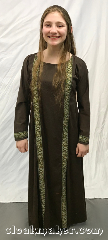 Gown ID:G936, Gown Color:Brown with Green gold cross trim, Style:12th Century youth, Sleeve:Long with Cross trim cuff, Trim:Cross trim on front and cuff <br>Gold, Green, White, Brown, Neckline Type:Scoop, Fabric:Cotton Lycra, Sleeve Length:28", Back Length:47".