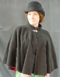 A lady's short cloak or mantle made of black windpro, a wind resistant material which is great for winter fall and spring.