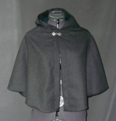 Cloak:1745, Cloak Style:Half Circle Child's, Cloak Color:Dark Charcoal Grey, Fiber / Weave:Brushed Gabardine Wool Cash, Cloak Clasp:Fleur de Lis, Hood Lining:Dark Green Poly Moleskin, Back Length:21", Neck Length:19.5", Seasons:Spring, Fall, Winter.