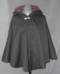 Cloak:1746, Cloak Style:Full Circle Short Cloak, Cloak Color:Heathered Black, Fiber / Weave:Tropic Weight Wool, Cloak Clasp:Florentine - Medium, Hood Lining:Dk Plum Poly Moleskin, Back Length:27", Neck Length:19.5", Seasons:Summer, Fall, Spring.