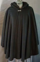 Cloak:1931, Cloak Style:Cape / Ruana, Cloak Color:Black, Fiber / Weave:WindPro Herringbone fleece, Cloak Clasp:Plain Rope<br>Hook & Eye, Hood Lining:Self-lining, Back Length:34", Neck Length:24", Seasons:Winter, Fall, Spring.