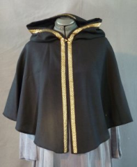 Cloak:1934, Cloak Style:Fuller Half circle with 4-Strand Celtic Gold Braid, Medium<br>on hood and edge, Cloak Color:Black, Fiber / Weave:Wool Crepe, Cloak Clasp:Double Spiral, Hood Lining:Unlined, Back Length:24", Neck Length:18", Seasons:Summer, Fall, Spring.