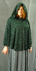 Cloak:1981, Cloak Style:Fuller Half circle, Cloak Color:Hunter Green flocked with Black and Multi-color glitter, Fiber / Weave:Polyester / Nylon, Cloak Clasp:Fleur de Lis, Hood Lining:Unlined, Back Length:32", Neck Length:19.5", Seasons:Summer, Fall, Spring.