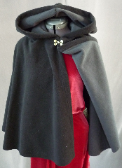 Cloak:2009, Cloak Style:Full Circle Short Cloak, Cloak Color:Black outside Grey inside, Fiber / Weave:Windblock Polar Fleece, Cloak Clasp:Double Spiral, Hood Lining:Self-lining (Grey), Back Length:23.5", Neck Length:19", Seasons:Winter, Fall, Spring.