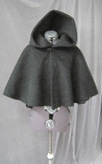 Cloak:2594, Cloak Style:Full Circle Short Cloak, Cloak Color:Black, Fiber / Weave:Heavy Wool Melton, Cloak Clasp:Plain Rope<br>Hook & Eye, Hood Lining:Unlined, Back Length:21", Neck Length:21", Seasons:Winter, Fall, Spring.