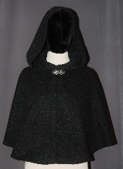 Cloak:3067, Cloak Style:Shaped Shoulder Cloak - Short, Cloak Color:Charcoal Grey, Fiber / Weave:80% Wool / 20% Nylon, Cloak Clasp:Vale, Hood Lining:Unlined, Back Length:23", Neck Length:20", Seasons:Fall, Spring, Southern Winter, Note:Perfect starter cloak for a child<br>or a fashionable adult<br>alternative to a shawl.<br>This dark grey short cloak<br>s made of a heathered<br>wool blend and feels like felt.<br>The silver tone Vale<br>hook and eye clasp completes<br>the look for cool evenings.<br>A fun addition to any wardrobe.<br>Dry Clean Only..