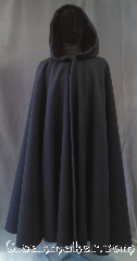 Cloak:3230, Cloak Style:Full Circle Cloak, Cloak Color:Ink Black, Fiber / Weave:100% Wool Melton, Cloak Clasp:Pick your own [additional cost]<br>Heavy duty required<br>No charge to attach clasp, Hood Lining:Bordeaux Red velvet, Back Length:49", Neck Length:21", Seasons:Winter, Southern Winter, Fall, Spring, Note:Your own portable warm room.<br>This ink black full circle cloak<br>made of a heavy thick wool melton blend<br>with a velvet bordeaux lined hood.<br>This is the warmest and thickest<br>single layer wool cloak we can produce.<br>Dry clean only.<br>A heavy duty clasp is highly recommended<br>for a cloak of this density<br>Clasp NOT included in price<br>but will be attached at no charge.