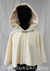 Cloak:3595, Cloak Style:Full Circle Cloak, Cloak Color:Ivory, Fiber / Weave:80% wool,<br> 20% nylon, Cloak Clasp:Vale - Goldtone, Hood Lining:Green gold<br>vine trim, Back Length:18.5", Neck Length:21", Seasons:Spring, Fall, Southern Winter.