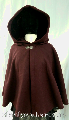 Cloak:3637, Cloak Style:Shaped Shoulder Cloak, Cloak Color:Burgundy Wine, Fiber / Weave:80% wool, 20% nylon, Cloak Clasp:Vale, Hood Lining:wine silk rayon velvet, Back Length:24", Neck Length:21.5", Seasons:Winter, Southern Winter, Fall, Spring, Note:A beautiful short length burgundy wine<br>colored cloak, with shaped shoulders<br>and a wine colored silk rayon<br>velvet hood lining.<br>Dry clean only..