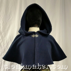 Cloak:3666, Cloak Style:Shaped Shoulder Cloak, Cloak Color:Navy Blue, Fiber / Weave:Windpro Fleece<br>from Malden Mills, Cloak Clasp:Vale, Hood Lining:unlined, Back Length:13", Neck Length:24", Seasons:Winter, Southern Winter, Fall, Spring, Note:This navy blue shaped shoulder cloak<br>is secured by a silvertone Vale clasp.<br>Wind blocking fleece material,<br>machine wash cold using mild<br>detergent and tumble dry on low..