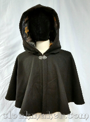 Cloak:3723, Cloak Style:Shaped Shoulder Cloak, Cloak Color:Very dark brown, Fiber / Weave:100% wool, Cloak Clasp:Vale, Hood Lining:Polyester sweatshirt fleece<br>in Hunter's Camo, Back Length:21", Neck Length:21", Seasons:Winter, Fall, Spring, Note:This very dark brown 100% wool<br>shaped shoulder style cloak<br>has a silvertone vale clasp<br>and a Polyester sweatshirt fleece<br>in Hunter's Camo hood lining.<br>You almost can't tell that this cloak<br>is brown until you hold it<br>against something black.<br>Dry clean only..