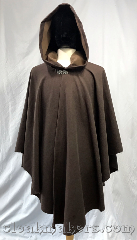 Cloak:3791, Cloak Style:Cape / Ruana, Cloak Color:Milk chocolate twill, Fiber / Weave:100% wool, Cloak Clasp:Vale, Hood Lining:Light brown flannel, Back Length:39.5", Neck Length:22", Seasons:Spring, Fall, Summer, Note:100% wool in a milk chocolate twill<br>will entice you.<br>This ruana style cloak has a<br>silvertone vale clasp and a<br>creamy light brown flannel<br>hood lining.<br>Dry clean only..