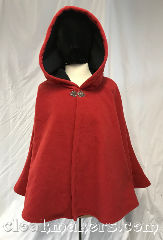 Cloak:3823, Cloak Style:Shaped Shoulder Cloak, Cloak Color:Tomato Red, Fiber / Weave:Windblok Fleece, Cloak Clasp:Vale, Hood Lining:self lined in black, Back Length:24", Neck Length:23.5", Seasons:Winter, Southern Winter, Spring, Fall, Note:On sale due to a patched hole<br>on the left shoulder.<br>Made froma a tomato red windblok fleece,<br>this self lined in black shaped shoulder cloak<br>stays closed with a silvertone vale clasp.<br>Machine washable!.